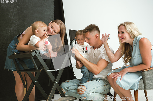 Image of Young family spending time together and smiling