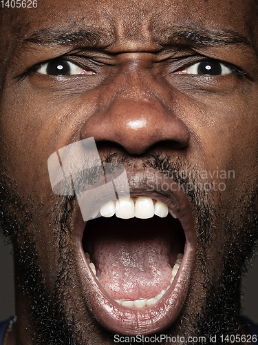 Image of Close up portrait of young african-american man