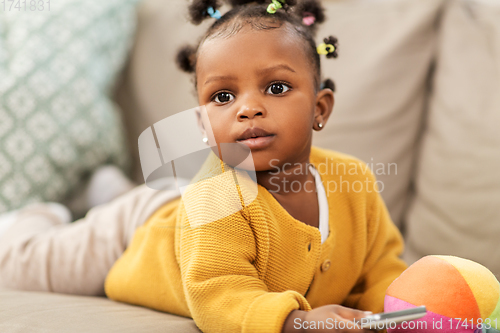 Image of african american baby girl with smartphone at home
