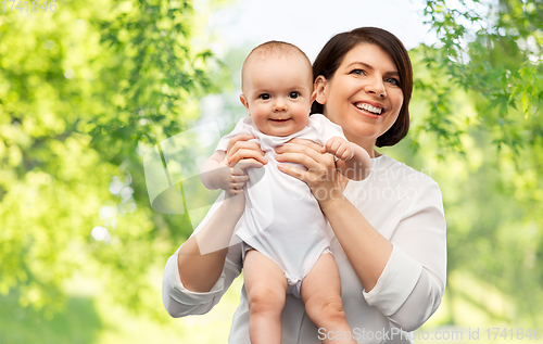 Image of happy middle-aged mother with little baby daughter