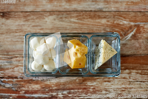 Image of different kinds of cheese in glass cups