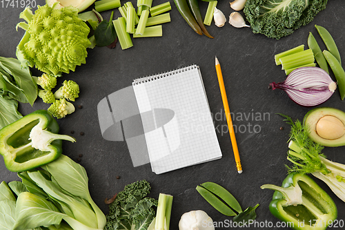 Image of green vegetables and diary with empty pages