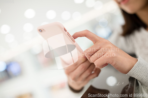 Image of Woman use of mobile phone