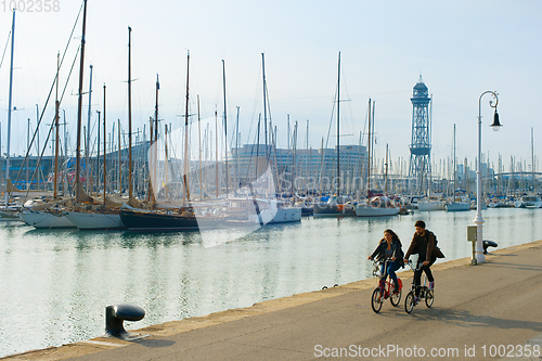 Image of Couple riding bikes. Barcelona, Spain