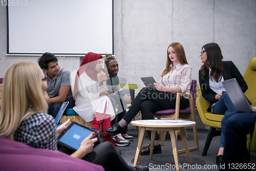 Image of Multiethnic startup business team having meeting