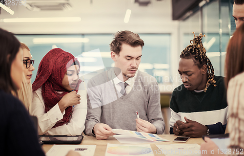 Image of Multiethnic startup business team having meeting