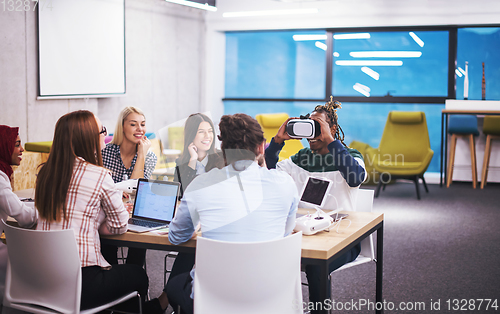 Image of Young Multiethnic Business team using virtual reality headset