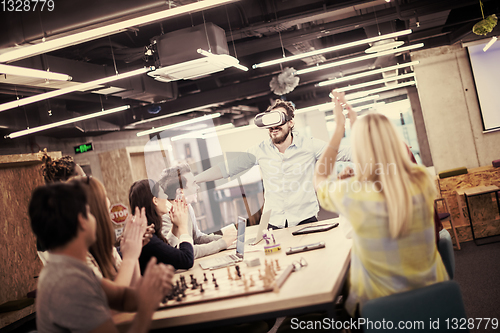 Image of Young Multiethnic Business team using virtual reality headset