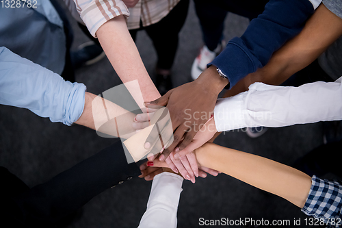 Image of multiethnic Group of young business people celebrating success