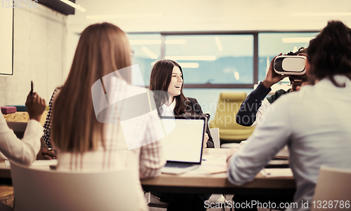 Image of Young Multiethnic Business team using virtual reality headset