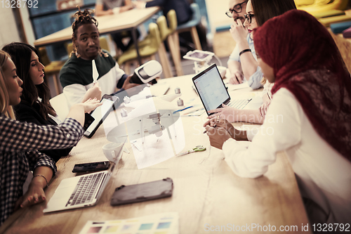 Image of multiethnic business team learning about drone technology