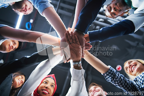 Image of multiethnic Group of young business people celebrating success