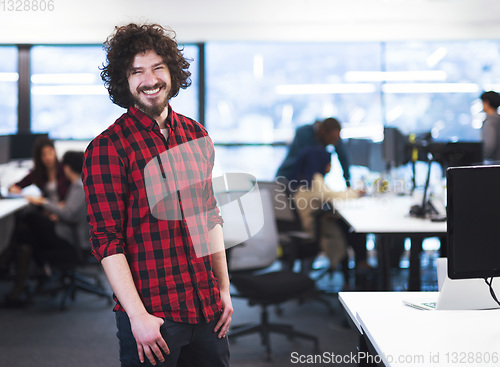 Image of Portrait of smiling male software developer