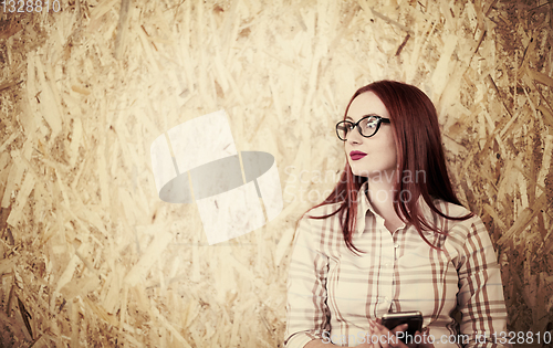 Image of portrait of young redhead business woman
