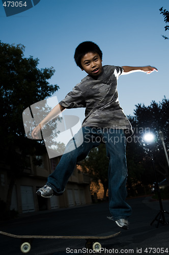 Image of Young skate boarder