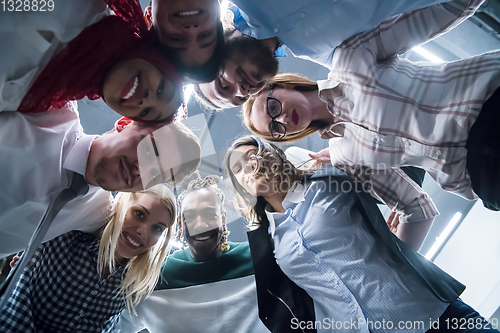 Image of multiethnic Group of young business people celebrating success