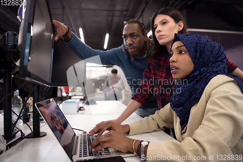 Image of multiethnics team of software developers working together