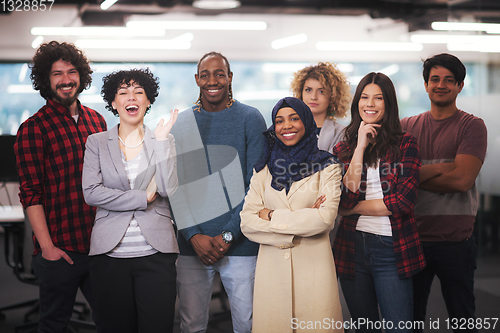 Image of portrait of young excited multiethnics business team