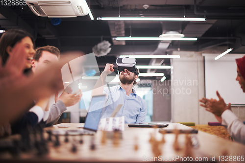 Image of Young Multiethnic Business team using virtual reality headset