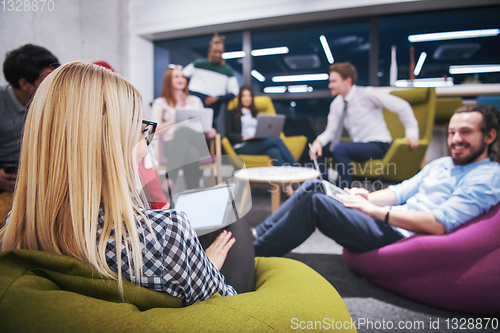 Image of blonde businesswoman using digital tablet