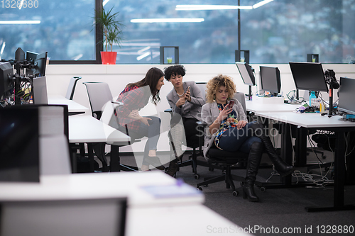 Image of female software developers using mobile phones