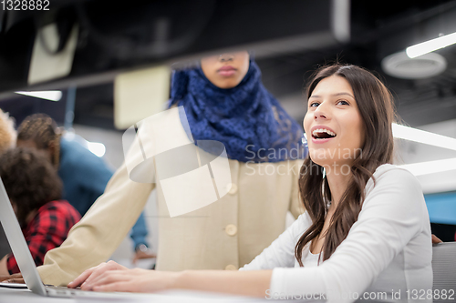 Image of multiethnics team of software developers working together