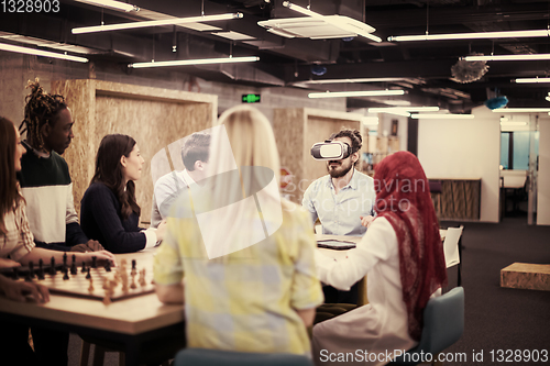 Image of Young Multiethnic Business team using virtual reality headset