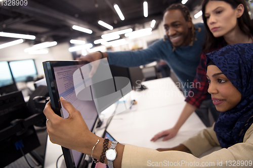 Image of multiethnics team of software developers working together