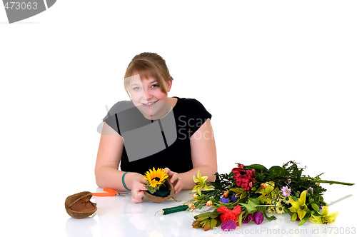 Image of Young girl arranging flowers 