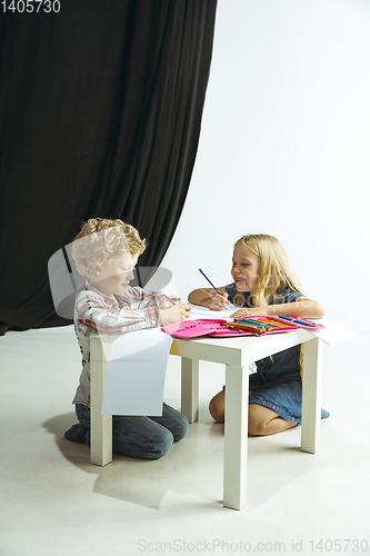 Image of Boy and girl preparing for school after a long summer break. Back to school.