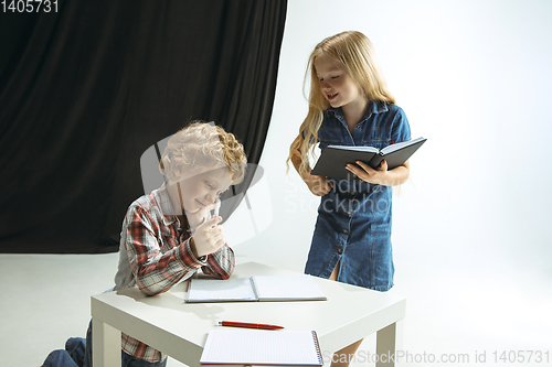 Image of Boy and girl preparing for school after a long summer break. Back to school.