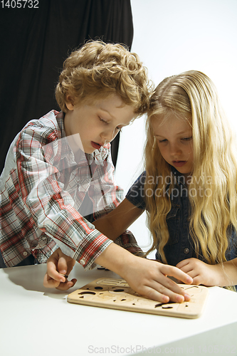 Image of Boy and girl preparing for school after a long summer break. Back to school.