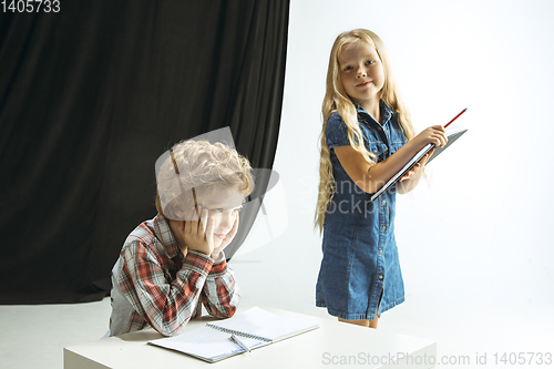 Image of Boy and girl preparing for school after a long summer break. Back to school.