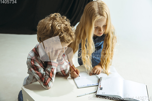 Image of Boy and girl preparing for school after a long summer break. Back to school.