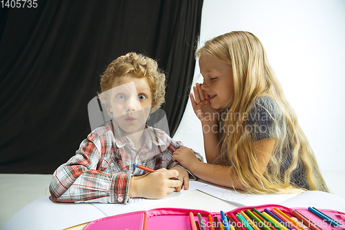 Image of Boy and girl preparing for school after a long summer break. Back to school.