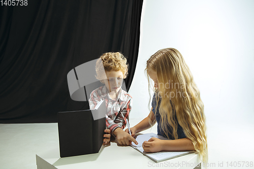 Image of Boy and girl preparing for school after a long summer break. Back to school.