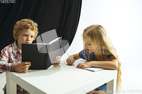 Image of Boy and girl preparing for school after a long summer break. Back to school.