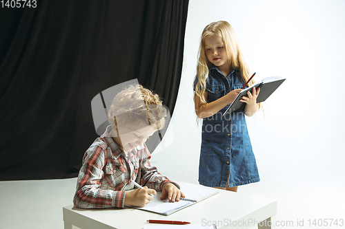 Image of Boy and girl preparing for school after a long summer break. Back to school.