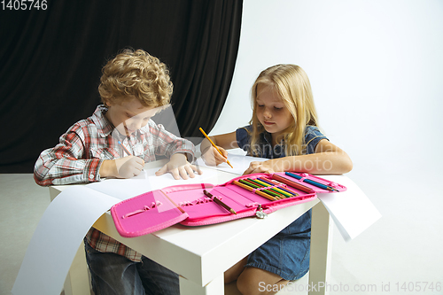 Image of Boy and girl preparing for school after a long summer break. Back to school.