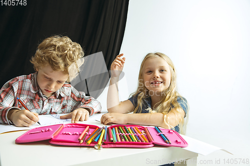 Image of Boy and girl preparing for school after a long summer break. Back to school.