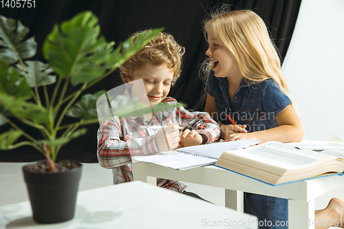 Image of Boy and girl preparing for school after a long summer break. Back to school.