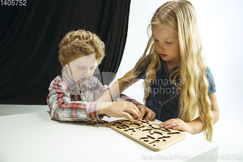 Image of Boy and girl preparing for school after a long summer break. Back to school.