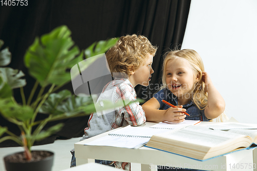 Image of Boy and girl preparing for school after a long summer break. Back to school.