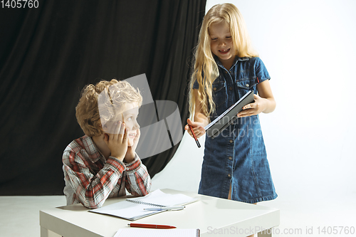 Image of Boy and girl preparing for school after a long summer break. Back to school.