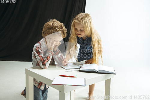 Image of Boy and girl preparing for school after a long summer break. Back to school.