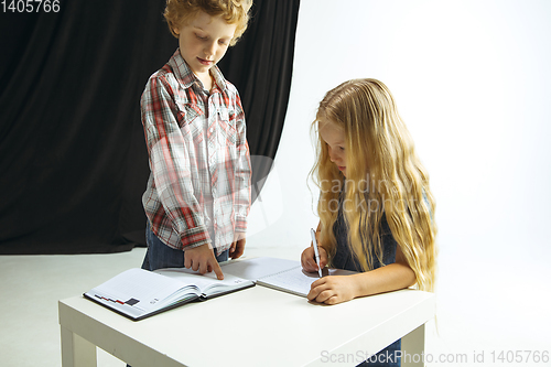 Image of Boy and girl preparing for school after a long summer break. Back to school.