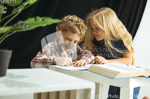 Image of Boy and girl preparing for school after a long summer break. Back to school.