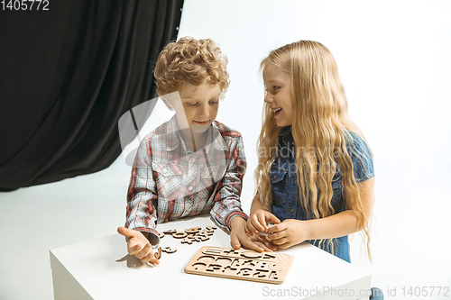 Image of Boy and girl preparing for school after a long summer break. Back to school.