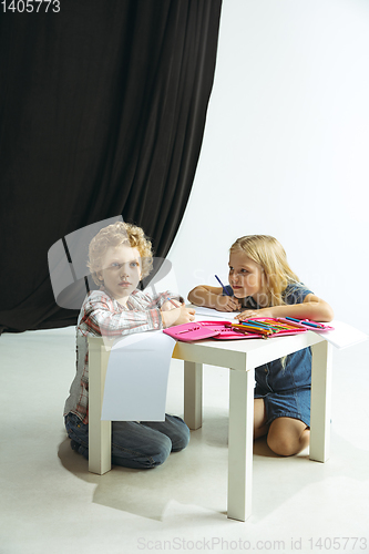 Image of Boy and girl preparing for school after a long summer break. Back to school.