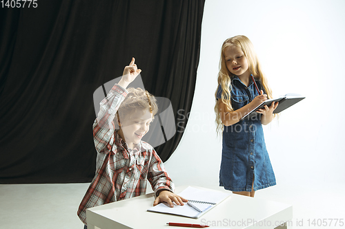 Image of Boy and girl preparing for school after a long summer break. Back to school.